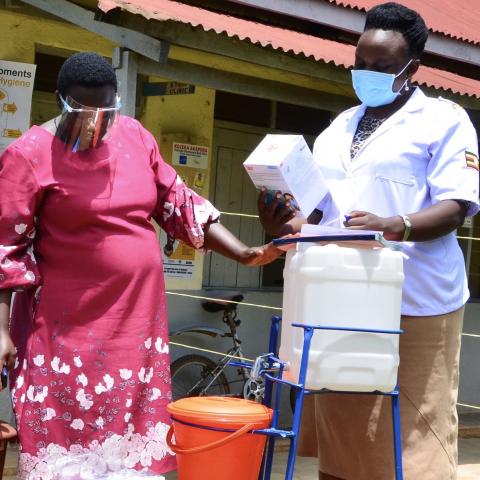 Cecilia Birungi in front of health care facility